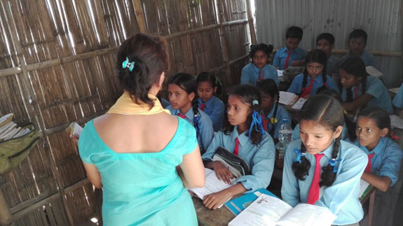 A teacher in Nepal explaining health to school children