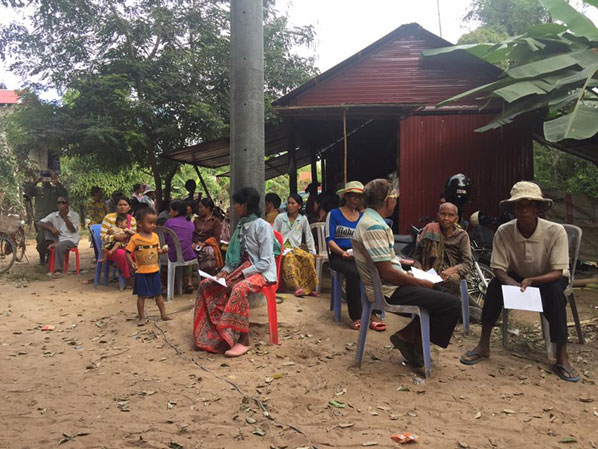 Local town people lining up to be seen by the philanthropic doctors in Cambodia